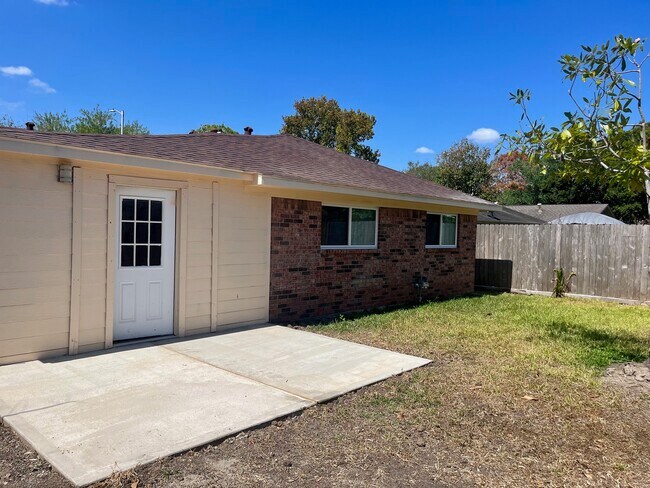 Backyard Exterior with New Cement Patio - 4823 Dollar Reef Dr