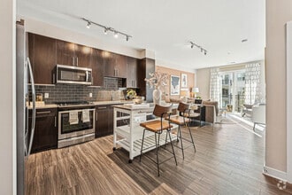 Modern kitchen with sleek finishes. - The Heights at Goose Creek Village