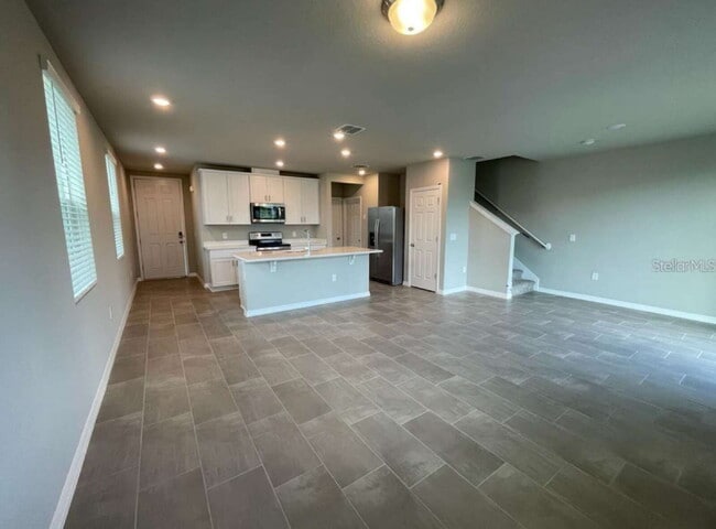 Photo - Beautiful corner unit townhouse features an abundance of natural
light.