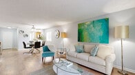 Located on Manatee Avenue West in Bradenton, Florida, this single-floor, 2-bedroom, 2-bathroom residence offers a thoughtfully arranged layout designed for comfortable everyday living. The living room serves as the heart of the home, featuring light wood-look flooring, soft neutral walls, and ample space for relaxing and entertaining. Natural light filters through the windows, enhancing the open and airy feel of the space.

The kitchen is well-equipped with warm wood cabinetry, light stone countertops, and stainless steel appliances including a refrigerator and over-the-range microwave, complemented by wood-look flooring that ties seamlessly into the main living areas. A window above the sink area brings in additional natural light.

The generously sized primary bedroom features plush carpeting, soft gray walls, and a window with blinds providing privacy. The second bedroom mirrors this comfortable aesthetic, offering built-in closet storage and natural light. Both rooms provide a calm, restful atmosphere.

The two bathrooms are clean and functional, each featuring a shower-tub combination, wood-look tile flooring, and wood-toned vanity cabinetry with a large mirror. A hallway connects the rooms efficiently, completing this well-organized and move-in ready Florida residence.