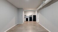 Located at 776 Baconsfield Dr in Macon, Georgia, this one-bedroom, one-bathroom unit offers a well-organized, single-floor layout designed for functional everyday living. The open living area flows directly into the kitchen, creating a connected and versatile space. Light wood-look flooring runs throughout, complemented by neutral gray walls and crisp white baseboards that lend a clean, modern aesthetic.

The kitchen is well-equipped, featuring white shaker-style cabinetry with gold hardware, granite-look countertops, and a full suite of black appliances including a dishwasher, electric range, and refrigerator. A stainless steel range hood and an under-cabinet sink round out the practical kitchen design.

The bedroom is generously proportioned, offering a bright and open feel thanks to a window that allows natural light to fill the room. Two doors provide access to both a closet and the hallway, ensuring convenient connectivity throughout the unit. The bathroom includes a full tub-shower combo with clean white surrounds, brushed nickel fixtures, and a towel rack, maintaining the home's consistent, updated style.

Additional spaces include a hallway, a dedicated utility room, and a closet, providing practical storage and household functionality. The unit presents a fresh, move-in-ready interior throughout.