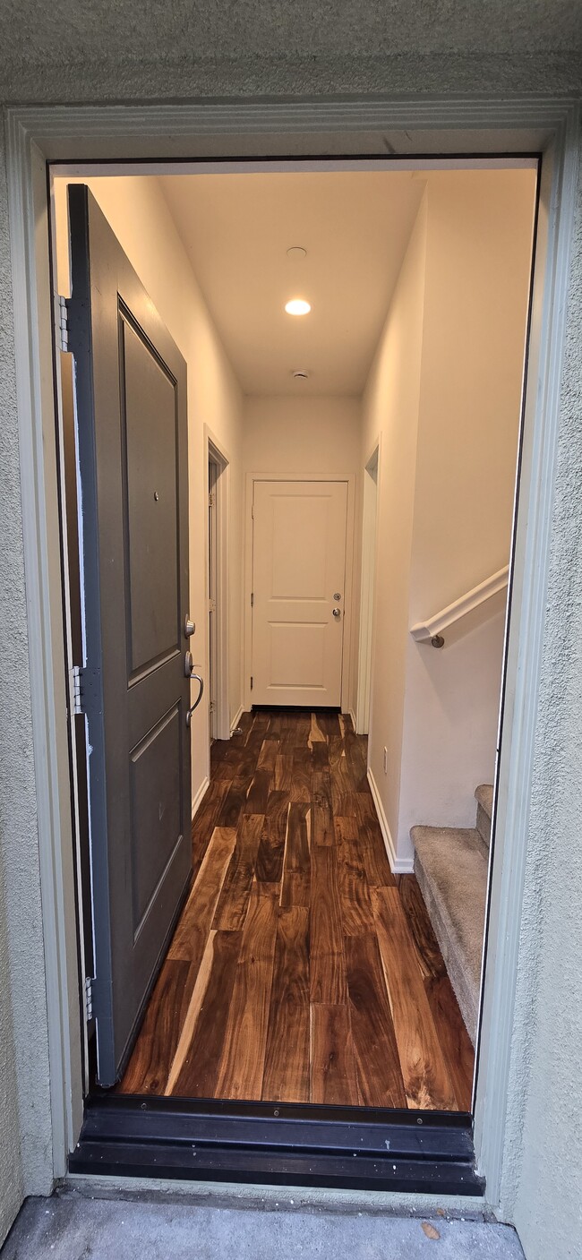 Entrance. Garage door at the end. 1st floor bedroom on the left & full bath on the right. - 315 Royal Gln