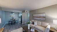 This 680 square foot apartment in Grand Prairie, Texas offers a thoughtfully designed living space with two bedrooms and one bathroom. The single-floor layout maximizes efficiency, featuring a modern kitchen, living room, and a closet for storage. The primary bedroom, measuring 150 square feet, provides ample space for comfortable living.

Throughout the apartment, wood-look flooring adds warmth and durability. The kitchen showcases a galley layout with white cabinetry, granite countertops, and stainless steel appliances, complemented by a striking tile backsplash. The bathroom features a clean, contemporary design with a white vanity and framed mirror.

Both bedrooms are equipped with ceiling fans for comfort and include windows that invite natural light. The living area is versatile, offering space for both relaxation and dining. Neutral wall colors create a calm ambiance, while carefully chosen artwork adds personality to each room.

The apartment's design emphasizes functionality without sacrificing style, making efficient use of the available square footage. Large windows in the living area and bedrooms provide natural illumination and views of the surroundings. Overall, this apartment presents a well-maintained, modern living space ideal for those seeking a cozy yet contemporary home in Grand Prairie.