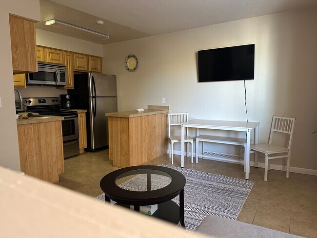 Dinning table for 4 people and TV - 1810 E Blacklidge Dr