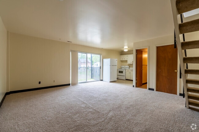 2BR, 1.5BA - 900SF - Living/Dining Room - Tradewind Apartments