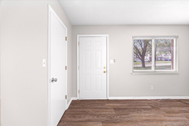 Living room facing front door - 8021 Holmes Rd