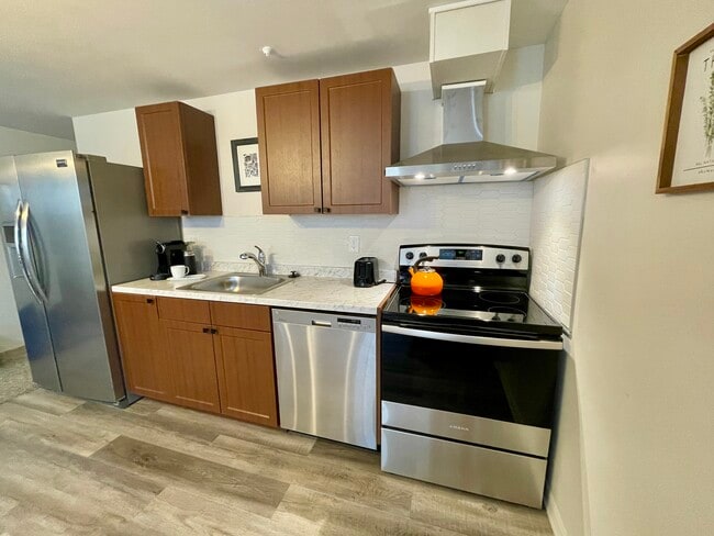 Kitchen with newer appliances - 8931 W 7th Ave