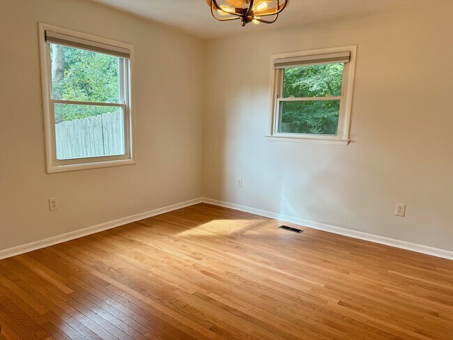 Primary bedroom on back of home. One window looks to the side yard and one to back yard - 6111 Northlakes Dr