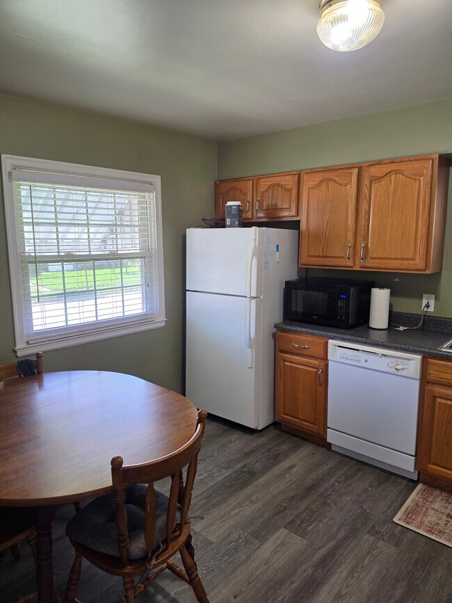 Kitchen w/ table and fridge - 1730 Morey Ave