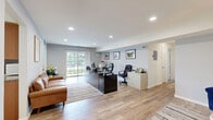 Located at 804 Cheryl Dr in Iselin, NJ, this well-appointed 2-bedroom, 2-bathroom residence offers a thoughtfully designed single-floor layout that maximizes comfort and functionality. A welcoming entryway hallway with light wood-look flooring leads into a bright, open living area with recessed lighting and a neutral gray-and-white color palette. The living room flows seamlessly into the dining area, which features a large window that brings in natural light, and connects to a galley-style kitchen outfitted with warm wood cabinetry, granite countertops, and ample storage. Sliding glass doors off the main living space open to a private balcony with outdoor views. The spacious primary bedroom is carpeted and includes an en-suite bathroom, while the second bedroom—also carpeted—offers a comfortable, well-lit space with a large window. Both bathrooms are finished with tile flooring, granite-topped vanities, and classic white cabinetry. Throughout the home, five closets provide exceptional storage. The overall ambiance is clean, modern, and move-in ready, with consistent finishes tying each space together cohesively.