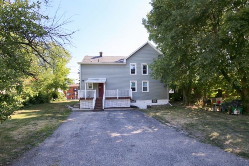 Front view of the house along St. John Street - 5302 Broadway