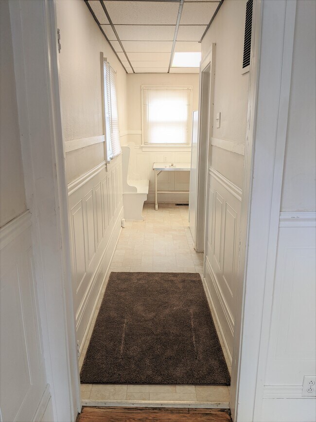 Hallway to kitchen, Bathroom door on right - 633 3rd St
