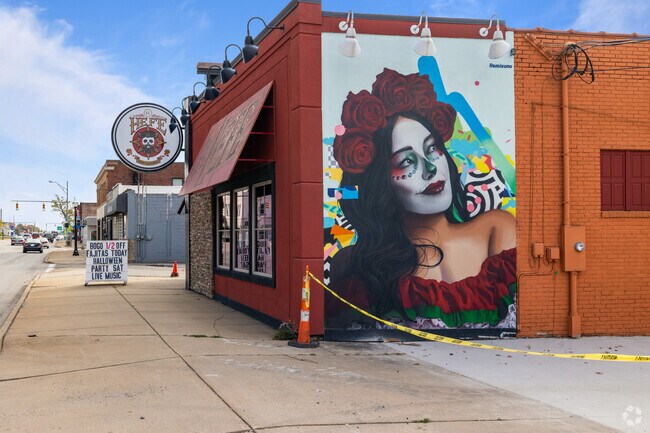 Residents enjoy the murals along North State Street in the Girard neighborhood.