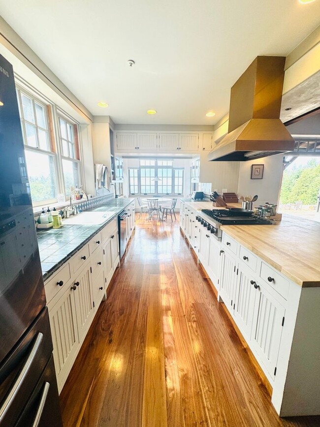 Building Photo - Majestic Farmhouse Retreat on 39 Acres with Sweeping Ocean Views