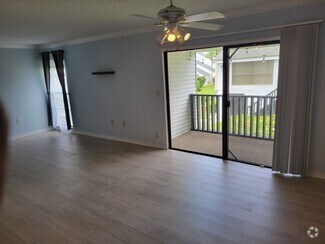 Ceiling fan and luxury vinyl flooring in open concept family / dining room - 651 Haven Pl