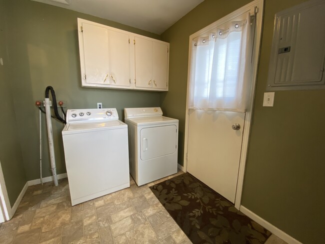 Side door entryway with washer/dryer - 618 Clayton Ave NW