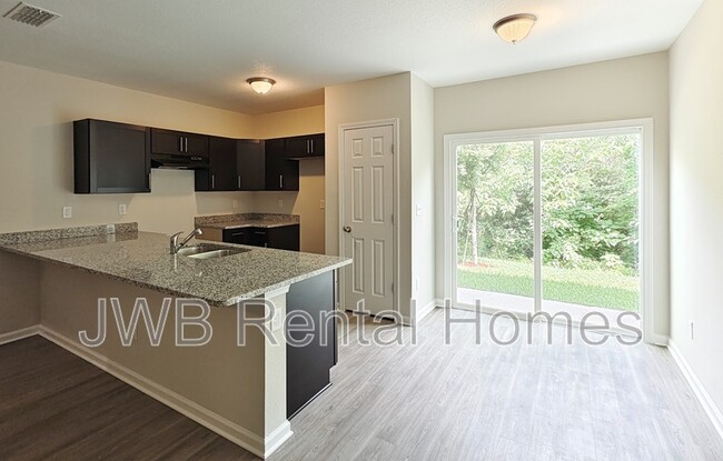 Foto del edificio - 6877 Lake Mist Ln