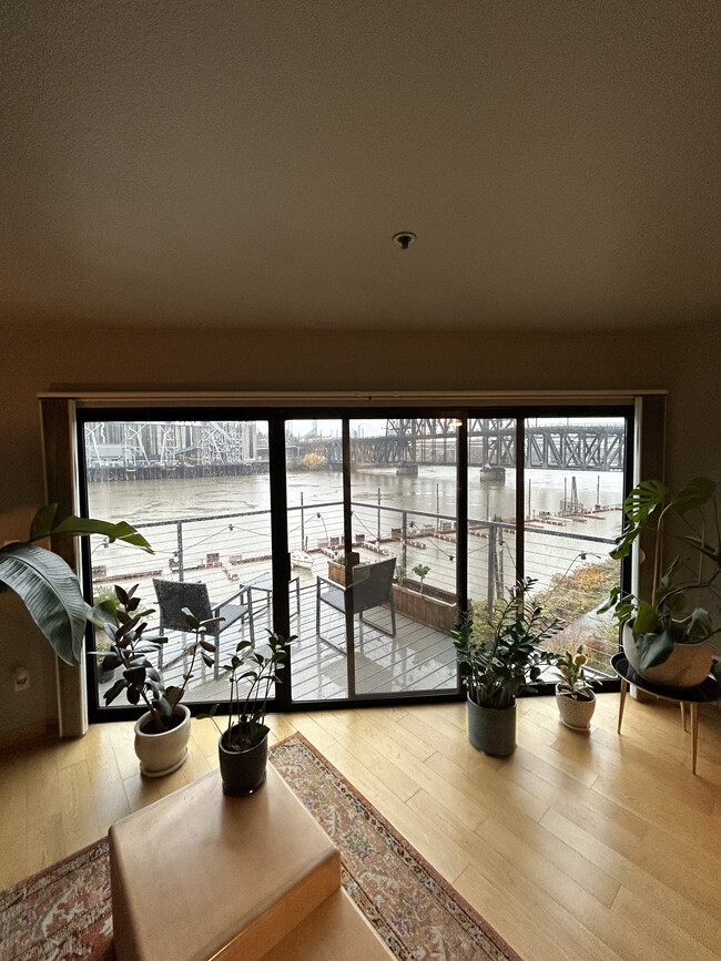 View of balcony/river from inside - 710 NW Naito Pky