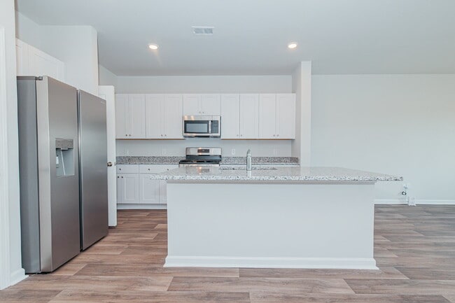 Building Photo - Brand-new 3 bedroom, 2.5 Bath Townhome with pond view