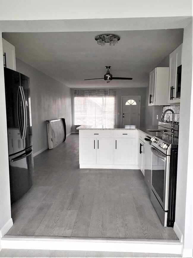 Kitchen access from Sunroom with open living space and top of the line designer features - 2072 Australia Way W