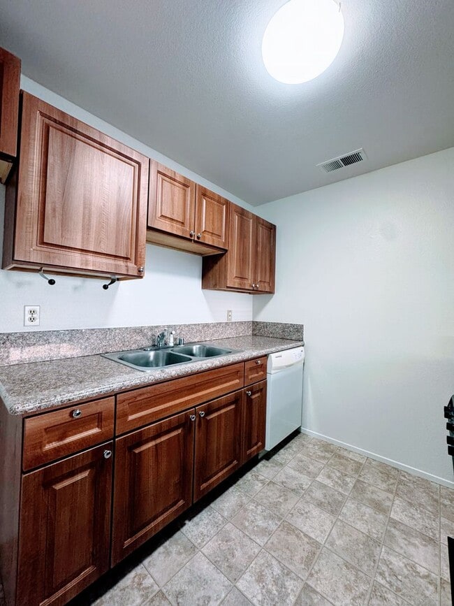 Building Photo - Charming 2-Bedroom Duplex with Large Fenced Yard & Attached Garage