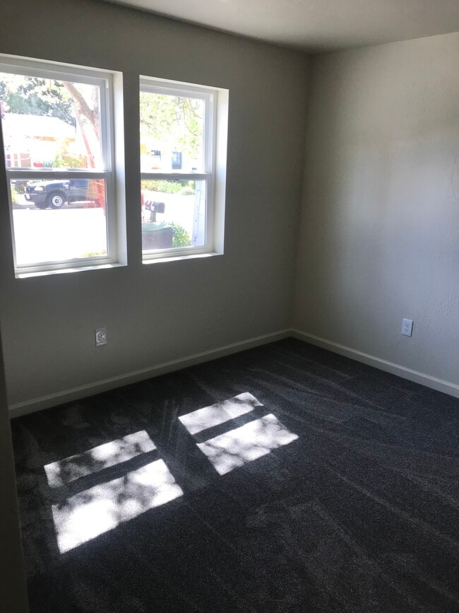 Bedrooms and bonus room have windows and carpeting. - 314 Rigg St