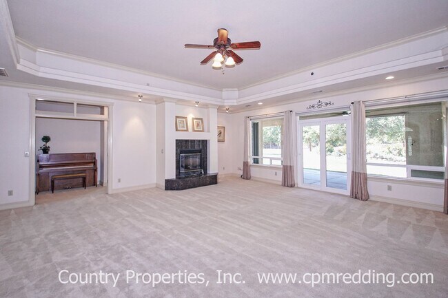 Building Photo - Gated Custom Home on Acreage with Solar an...