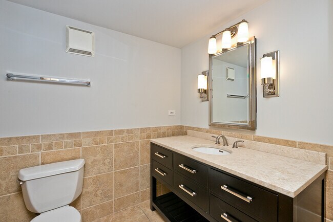 Building Photo - This two bedroom, two bathroom brick expos...