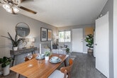 Located at 1900 S Campus Ave in Ontario, California, this single-floor residence offers a thoughtfully designed layout that balances comfort and functionality. The open-concept living and dining area serves as the heart of the home, featuring light wood-style flooring, a textured ceiling, and a ceiling fan that promotes year-round airflow. Large windows and a sliding glass door flood the space with natural light and provide direct access to an outdoor patio area, creating a seamless indoor-outdoor connection. The living area is well-proportioned, offering ample room for seating and entertaining.

The kitchen is efficiently designed with crisp white cabinetry, stone-look countertops, a stainless steel sink, open shelving for display or storage, and a stainless steel gas range, providing all the essentials for everyday cooking.

The bedroom is a calm, restful retreat finished with the same light flooring, neutral gray walls, and vertical blinds that offer privacy while still welcoming natural light. A sliding closet provides convenient built-in storage. The full bathroom is clean and practical, featuring a tub and shower combination, wood-look tile flooring, and a bright window for ventilation. Overall, the unit presents a modern, cohesive aesthetic throughout.