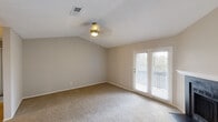 Located at 2029 Flagstone Dr in Madison, Alabama, this single-story, one-bedroom, two-bathroom home offers a well-organized layout designed for comfortable everyday living. The living room features vaulted ceilings, soft carpeting, a ceiling fan with light, a fireplace, and French doors that open to a private outdoor area, allowing natural light to flow freely into the space. The kitchen is well-appointed with stainless steel appliances — including a refrigerator, electric range, and built-in microwave — complemented by crisp white cabinetry, granite countertops, and wood-look flooring that adds warmth and durability. The spacious primary bedroom is carpeted and includes a ceiling fan, a natural light-admitting window, and direct access to a dedicated closet complete with wire shelving. The two bathrooms are functional and clean; one features a full tub/shower combo with chrome fixtures, while the other includes a wide granite-topped vanity with an undermount sink, a large mirror, and wood-look flooring. Hallways connect the rooms efficiently throughout the home. Neutral tones, textured ceilings, and consistent finishes give the entire space a cohesive, move-in-ready feel.