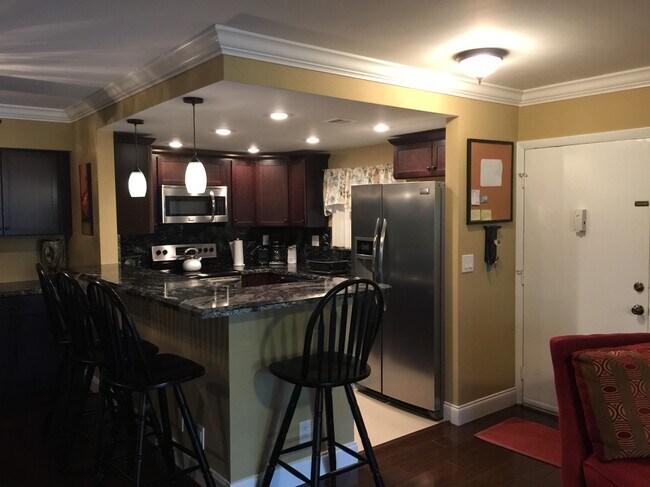 Vista de la cocina desde la sala de estar - 123 Deer Creek Blvd