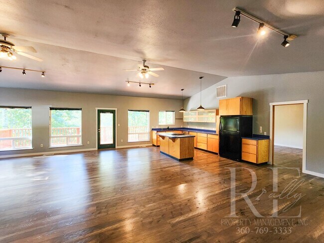Building Photo - Vaulted Ceilings, Unique Designer Kitchen & Expansive Half-Acre Setting with Flexible Living Spaces