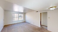 Located at 10852 Verhaven Ln in Saint Louis, MO, this two-bedroom, one-bathroom unit offers a practical and well-organized single-floor layout. The living room is bright and open, featuring plush carpeting, neutral white walls, and a large window that invites natural light and outdoor views. Adjacent to the living area, a dedicated dining space provides a natural flow for everyday living and entertaining.

The kitchen is equipped with warm oak cabinetry, a gas range, a stainless steel sink, and tile backsplash, complemented by a window overlooking the exterior. The tile flooring adds a clean, durable touch to this functional cooking space.

Both bedrooms are carpeted and outfitted with ceiling fans for year-round comfort. The primary bedroom is a generous size, featuring a large window for natural light and a sliding glass door leading to a private balcony — a standout feature of the space. It also includes multiple closets, offering abundant storage. The second bedroom is equally well-lit with its own window and ceiling fan.

The bathroom includes a full tub-shower combination with chrome fixtures and a window for natural ventilation. A hallway connects the main living areas, and three total closets throughout the unit ensure ample storage for everyday needs.