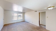 Located at 10852 Verhaven Ln in Saint Louis, MO, this two-bedroom, one-bathroom unit offers a practical and well-organized single-floor layout. The living room is bright and open, featuring plush carpeting, neutral white walls, and a large window that invites natural light and outdoor views. Adjacent to the living area, a dedicated dining space provides a natural flow for everyday living and entertaining.

The kitchen is equipped with warm oak cabinetry, a gas range, a stainless steel sink, and tile backsplash, complemented by a window overlooking the exterior. The tile flooring adds a clean, durable touch to this functional cooking space.

Both bedrooms are carpeted and outfitted with ceiling fans for year-round comfort. The primary bedroom is a generous size, featuring a large window for natural light and a sliding glass door leading to a private balcony — a standout feature of the space. It also includes multiple closets, offering abundant storage. The second bedroom is equally well-lit with its own window and ceiling fan.

The bathroom includes a full tub-shower combination with chrome fixtures and a window for natural ventilation. A hallway connects the main living areas, and three total closets throughout the unit ensure ample storage for everyday needs.