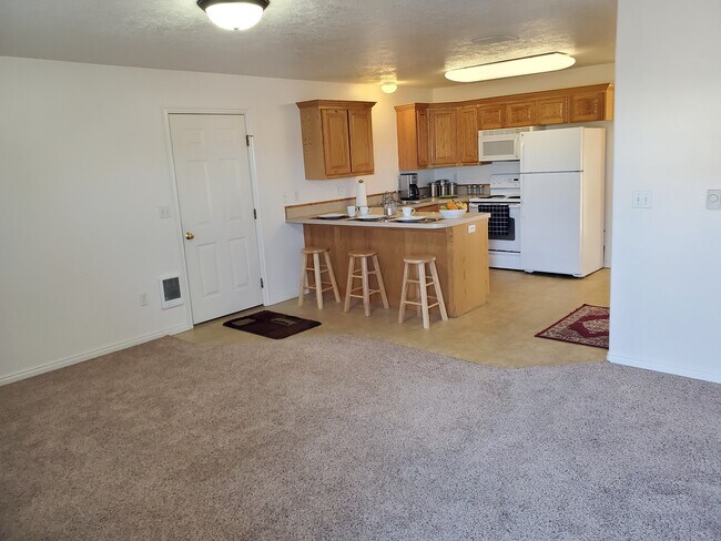 Living Room to Kitchen with Breakfast Bar - 3304 Briar Creek Ln