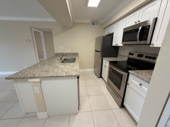 Building Photo - ANNUAL RENTAL - 2 BED / 2 BATH CONDO AT MYSTIC GARDENS