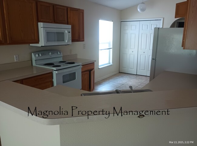 Building Photo - New Paint, Floors and Solid Surface Counte...