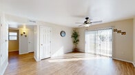 Located at 5757 Will Ruth Ave in El Paso, Texas, this single-story, three-bedroom, one-bathroom home offers a practical and well-maintained layout designed for comfortable everyday living. Light-toned wood-look flooring runs throughout the entire home, creating a cohesive and easy-to-maintain interior.

The living room is a bright, open space anchored by a ceiling fan with a light fixture and large sliding glass doors fitted with vertical blinds, allowing abundant natural light and access to the outdoors. The kitchen features rich, dark wood cabinetry paired with white appliances — including a refrigerator, gas range, microwave, and dishwasher — and is illuminated by a central ceiling light. It connects conveniently to the living area, supporting an open flow between the two spaces.

Each of the three bedrooms is equipped with a ceiling fan and benefits from natural light through well-placed windows. The bedrooms include closets with sliding or standard doors, offering practical storage. The primary bedroom features a cozy, sunlit atmosphere with a closet accessed via a classic panel door.

The bathroom includes a full tub-shower combination with built-in shelving niches and a window that brings in natural light. Clean, neutral wall tones are consistent throughout the home, reinforcing a calm and inviting atmosphere well-suited to a variety of lifestyles.