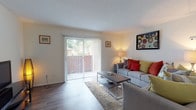 Located at 1201 Seminole Blvd in Largo, Florida, this single-floor residence offers a well-organized layout designed for comfortable everyday living. The living room serves as the heart of the home, featuring durable wood-style flooring, a textured ceiling, and a large sliding glass door fitted with vertical blinds that opens to a private outdoor balcony, allowing natural light to fill the space. The galley-style kitchen is efficiently designed with white cabinetry, dark granite-look countertops, and black appliances, providing ample storage and prep space. The primary bedroom is generously sized, featuring plush carpeting, a large closet, and a bright window with blinds, offering a comfortable and restful retreat. Additional bedrooms are equally well-appointed with soft carpeting, natural light from windowed walls, and room for functional furnishings. The full bathroom is finished with wood-style flooring, white cabinetry, a combined tub and shower, and clean white tile, offering a bright and practical space. Throughout the residence, a neutral color palette and consistent finishes create a cohesive and inviting ambiance, making this Largo property a practical and comfortable home.