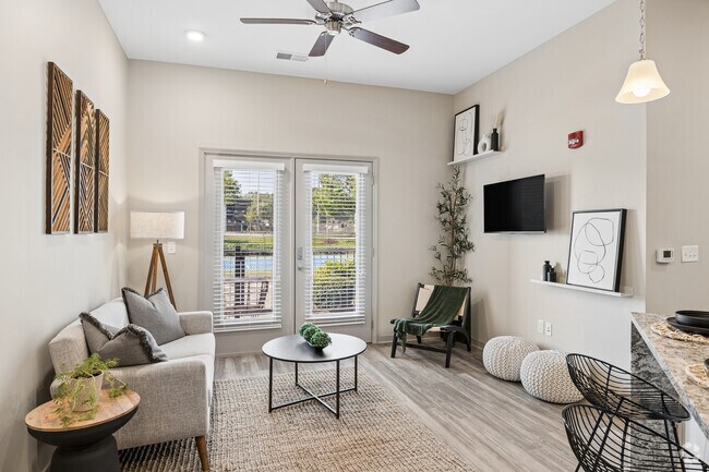 Oakwood - 2 habitaciones, 2 baños - 1110 pies cuadrados - Sala de estar - Woodstone at Metro North Crossing