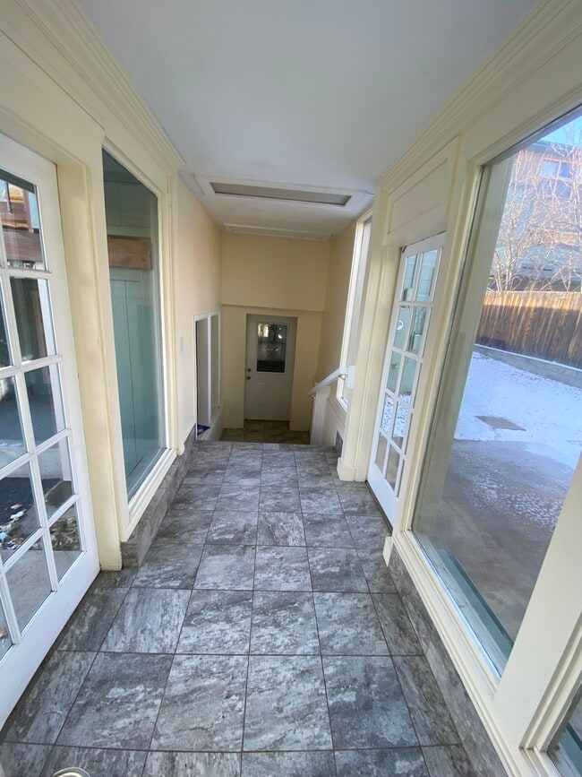 Covered vestibule/mudroom from garage to front door - 111 Washington Ave