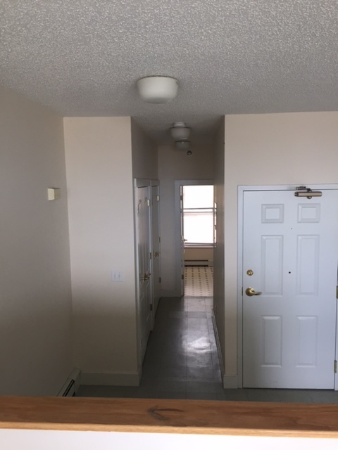 front door and hallway to bedroom and bathroom - 22 W 3rd St