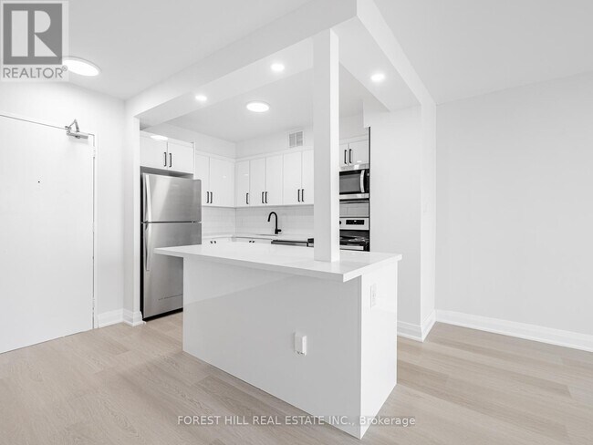 Photo du bâtiment - 377-1377 Ridelle Ave