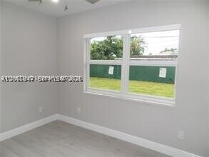 Building Photo - 6540 W 11th Ln