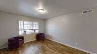 Located on Martin Luther King Jr Blvd in Houston, Texas, this single-story home offers a practical and well-organized layout across three bedrooms, one bathroom, a living room, and a closet. Warm wood-look flooring runs consistently throughout the entire home, lending a cohesive and clean aesthetic to every room.

The living room is a comfortable gathering space featuring a large window that allows natural light to fill the room, complemented by textured ceilings and neutral gray walls. The primary bedroom is a well-sized retreat with its own window providing natural light, while the two additional bedrooms share a similar design — each with windows, matching flooring, and ceiling-mounted light fixtures.

The full bathroom is neatly appointed with white cabinetry, a dark granite-style countertop, a framed mirror, and a tub-shower combination with a curtain enclosure, all finished with wood-look flooring.

One of the bedrooms includes access to a dedicated closet as well as a hallway connection, offering added flexibility. The textured ceilings and consistent neutral color palette throughout create a calm, understated ambiance. The floor plan is efficiently organized for comfortable day-to-day living, making this home a functional and accessible option in the Houston area.