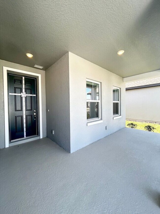 Building Photo - Stylish Sunbrooke Sanctuary! Modern 4/2 Ho...