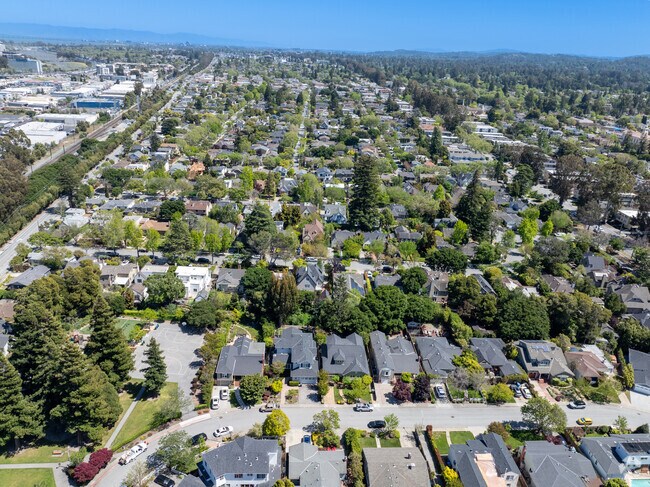 Burlingame Village from above reveals tree-lined tranquility in a bustling neighborhood.