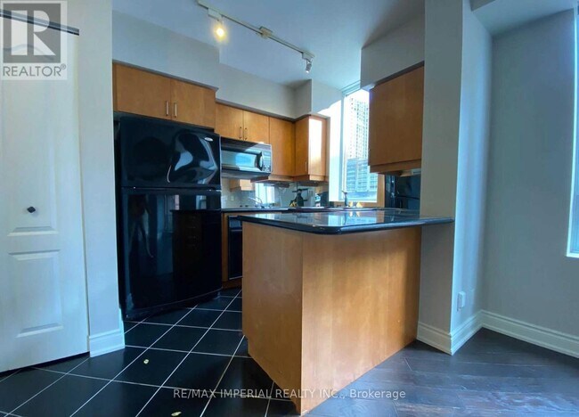 Photo du bâtiment - 20 Collier St