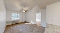 Located at 1501 Shepherd Rd in Lakeland, FL, this single-floor, 2-bedroom, 2-bathroom home offers a well-organized layout with practical living spaces throughout. The open-concept living and dining area is bright and inviting, featuring plush carpet flooring, a vaulted ceiling, a ceiling fan, and a large window that fills the space with natural light. A peninsula with granite-style countertops seamlessly connects the living area to the kitchen, which is equipped with white shaker cabinetry, matching white appliances including a range, dishwasher, and refrigerator, as well as durable wood-look flooring. A pantry provides added storage convenience. The primary bedroom is generously sized, complete with a ceiling fan, carpeted flooring, a spacious walk-in closet featuring wire shelving on both walls, and direct access to its own bathroom. The second bedroom also includes carpet, a ceiling fan, and a sliding-door closet. Both bathrooms feature wood-look flooring, white vanity cabinetry, and a full tub-shower combination. Additional highlights include three closets for ample storage, a dedicated laundry room, and a hallway connecting the key areas of the home for a functional and efficient flow.