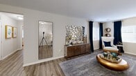 Located at 23 Ascot Point Cir in Asheville, NC, this single-story residence offers two bedrooms, two bathrooms, and a thoughtfully designed layout that makes efficient use of its space. The open-concept living room serves as the heart of the home, featuring wood-look plank flooring, neutral walls, and natural light from windows dressed with classic blinds. A hallway connects the main living areas to the private quarters, with two closets providing ample storage throughout.

The kitchen is outfitted with rich dark cabinetry, granite-style countertops, and stainless steel appliances including a range, microwave, and refrigerator. An adjacent dining area offers a comfortable space for meals.

The primary bedroom features plush carpeting, a ceiling fan, and a private en-suite bathroom complete with dark vanity cabinetry, granite countertops, and a tub/shower combo. A dedicated closet adds to its functionality. The second bedroom also features carpeting, a ceiling fan, a window with outdoor views, and its own closet. The second bathroom mirrors the refined finishes found throughout, with wood-look flooring, an octagonal mirror, and a clean, modern vanity. Together, these spaces deliver a cohesive and comfortable living environment in the heart of Asheville.
